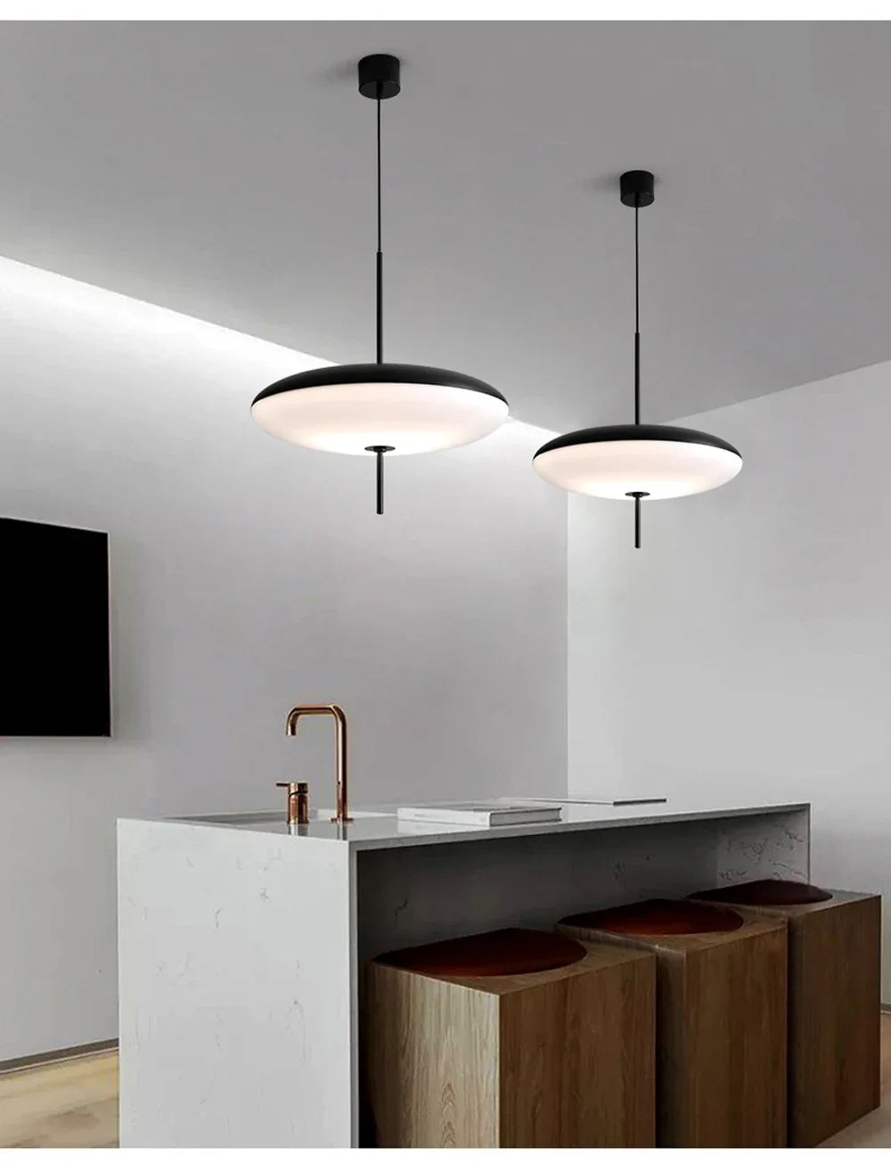 Nordic flying saucer LED pendant light hanging in a modern living room with minimalist décor.
