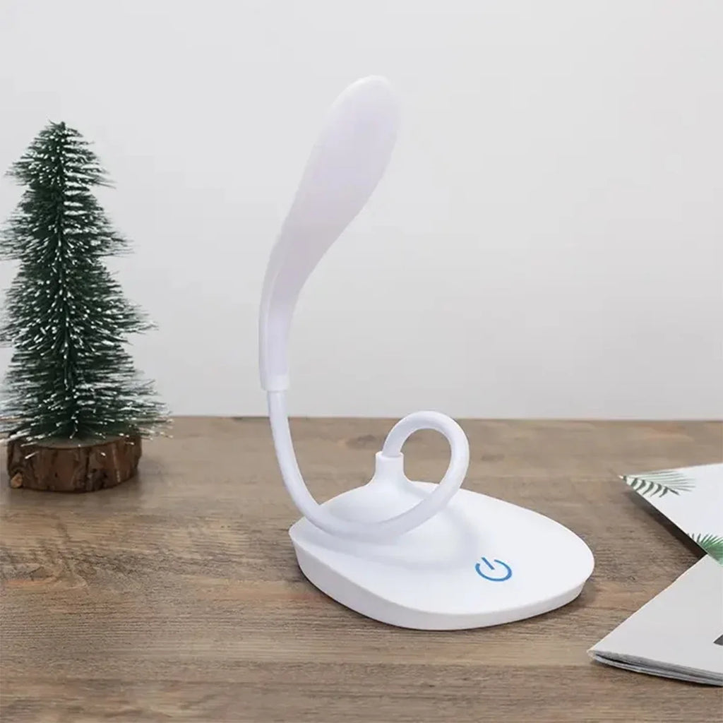 Modern LED eye care desk lamp with USB charging and touch dimming on a study desk.