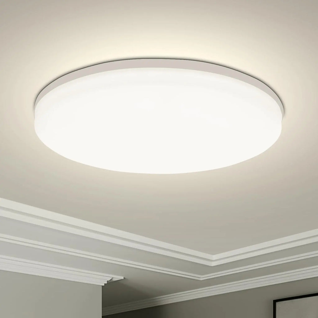 Modern round LED ceiling light installed in a contemporary living room with bright energy-efficient illumination.