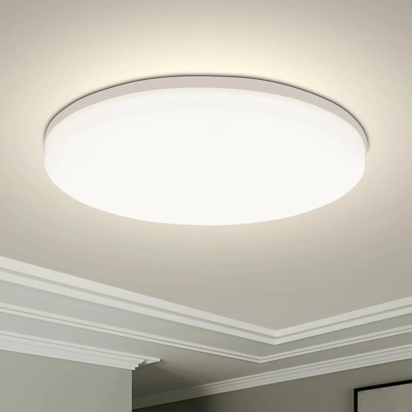 Modern round LED ceiling light installed in a contemporary living room with bright energy-efficient illumination.
